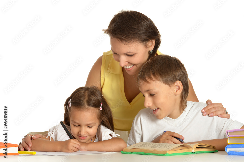 Mother doing homework with her kids Mother doing homework with her kids