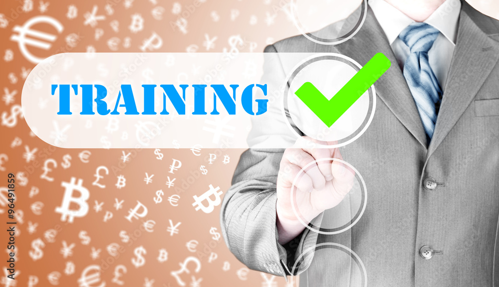 Businessman pressing touch screen interface training checkbox Businessman pressing touch screen interface training checkbox