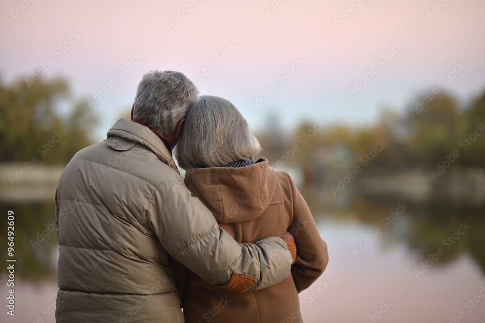 senior couple near river