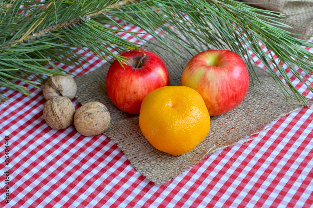 Christmas food. Fruits and walnuts