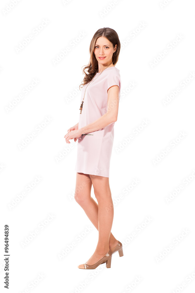 Young slim pretty woman in pink dress posing Young slim pretty woman in pink dress posing