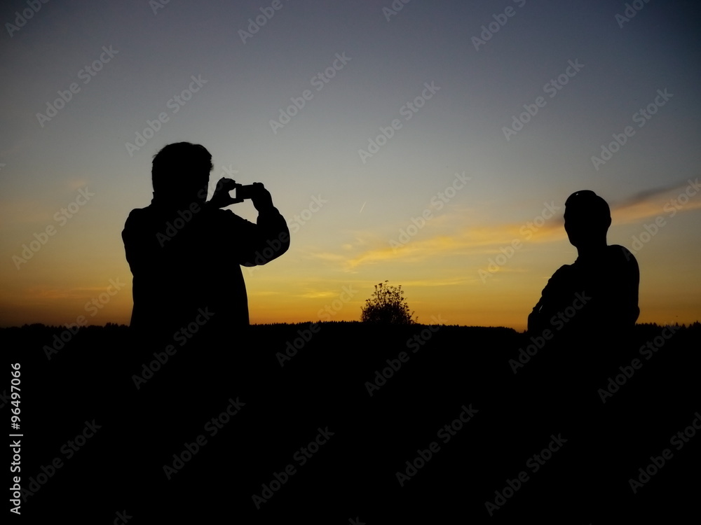 silhouette of man photographing