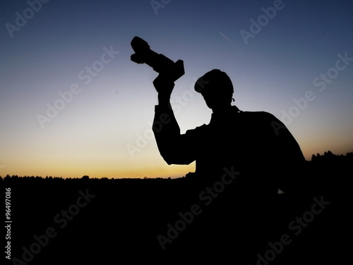 man photographing silhouette