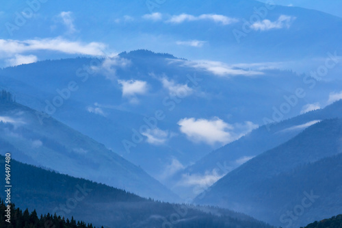 mountain backbone silhouette in a blue mist