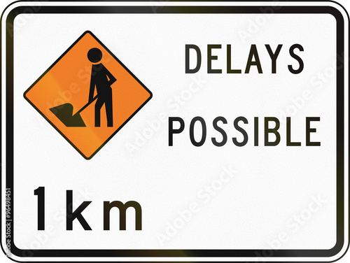 New Zealand road sign - Road workers ahead in 1 kilometre, delays possible photo