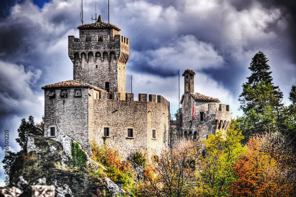medieval tower in San Marino under a cloudy sky medieval tower in San Marino under a cloudy sky