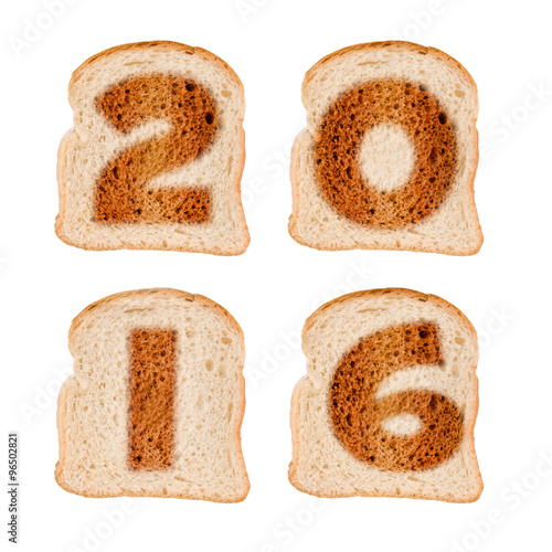 2016 greeting card on toasted slices of bread isolated on white background