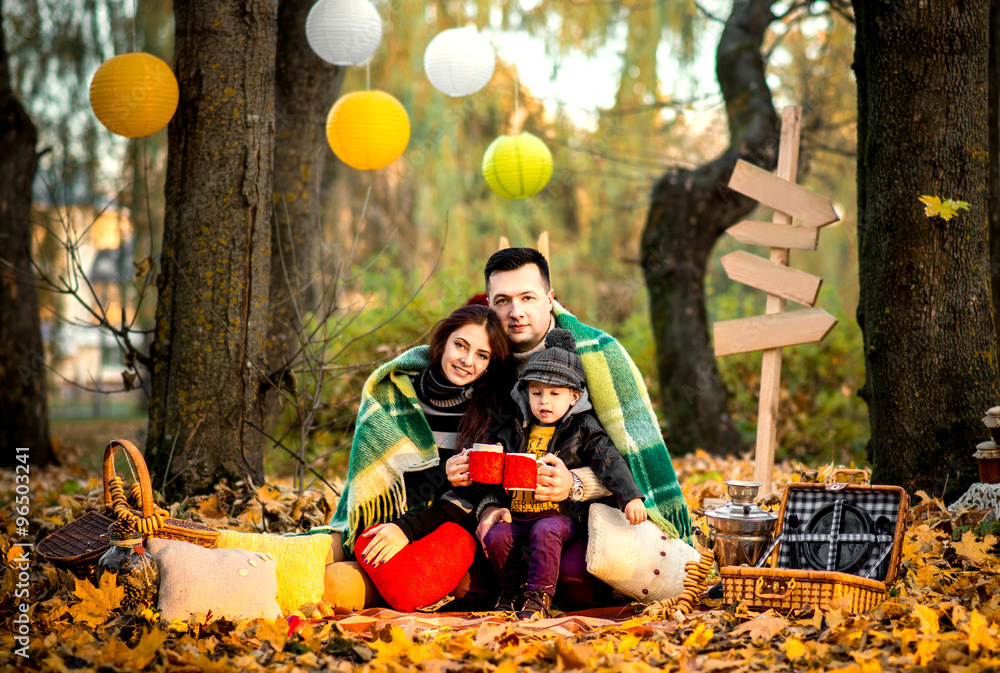 Happy family in the park, autumn time