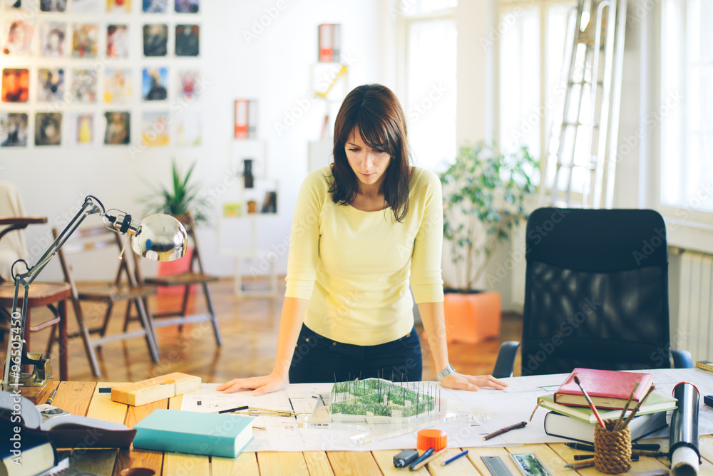 Female architect/designer at modern office Female architect/designer at modern office