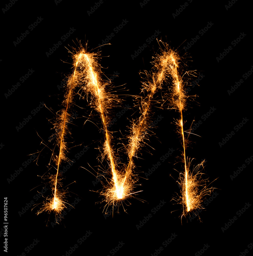 Sparkler firework light alphabet M (Capital Letters) at night