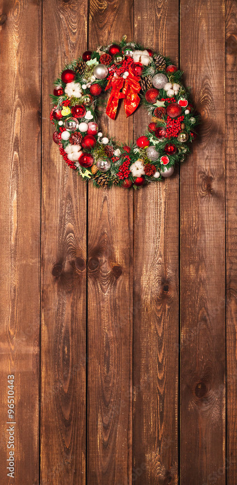 Beautiful Christmas wreath on the wooden background