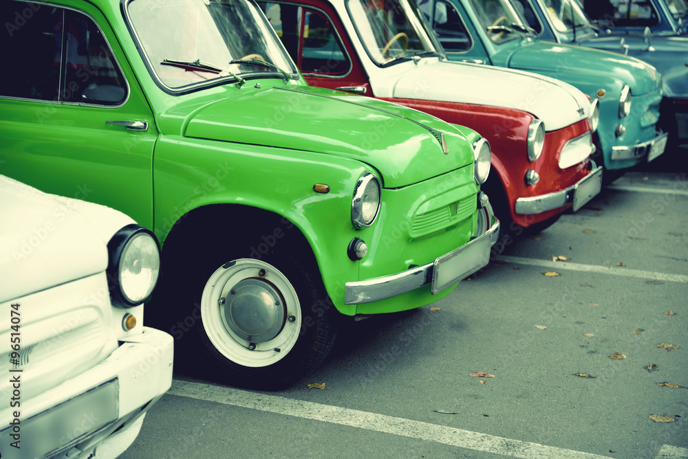 The composition of the same vintage cars of different colors. Re