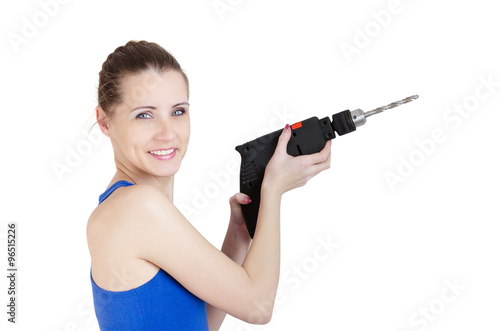 Beautiful smiling woman with electric drill in hand