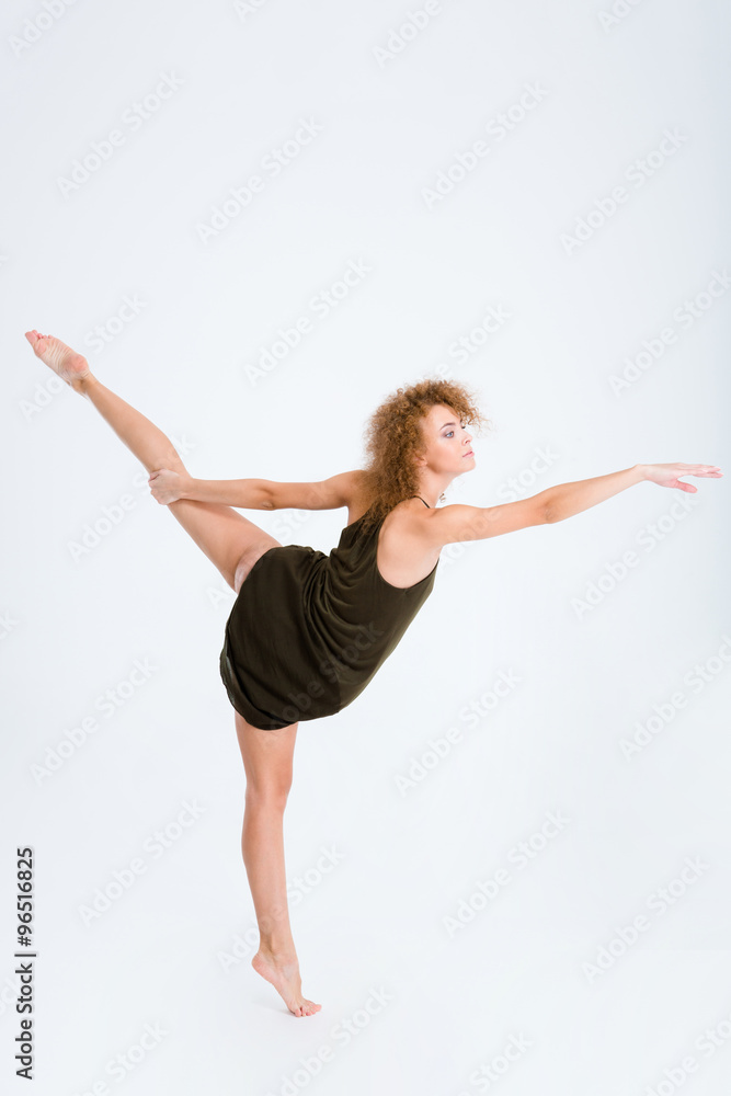 Female ballerina with curly hair dancing