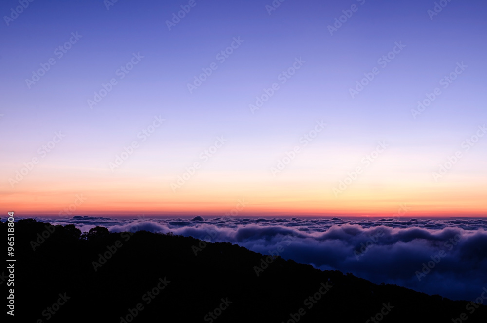 Dramatic sunrise on top of mountain
