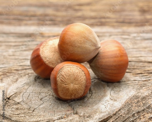 Hazelnuts on wooden background