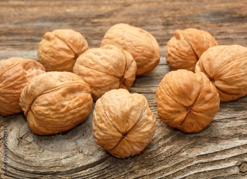 walnuts on wooden background © Adi Ciurea