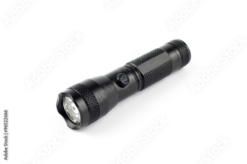 black metallic flashlight,isolated background