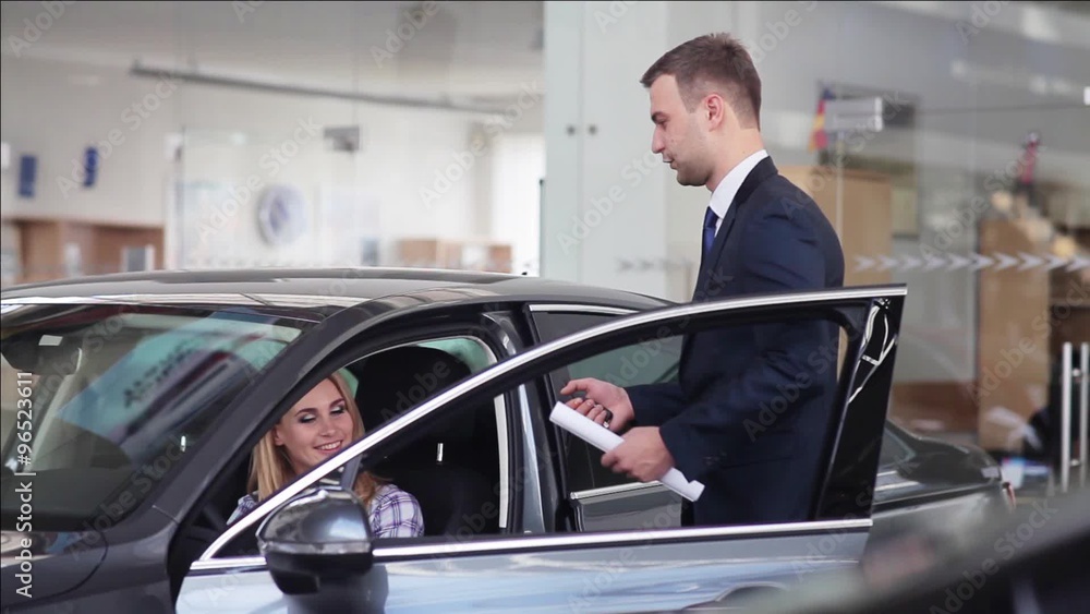 Car sales manager communicating with customer Car sales manager communicating with customer