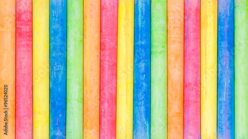 Row of rainbow colored chalk background