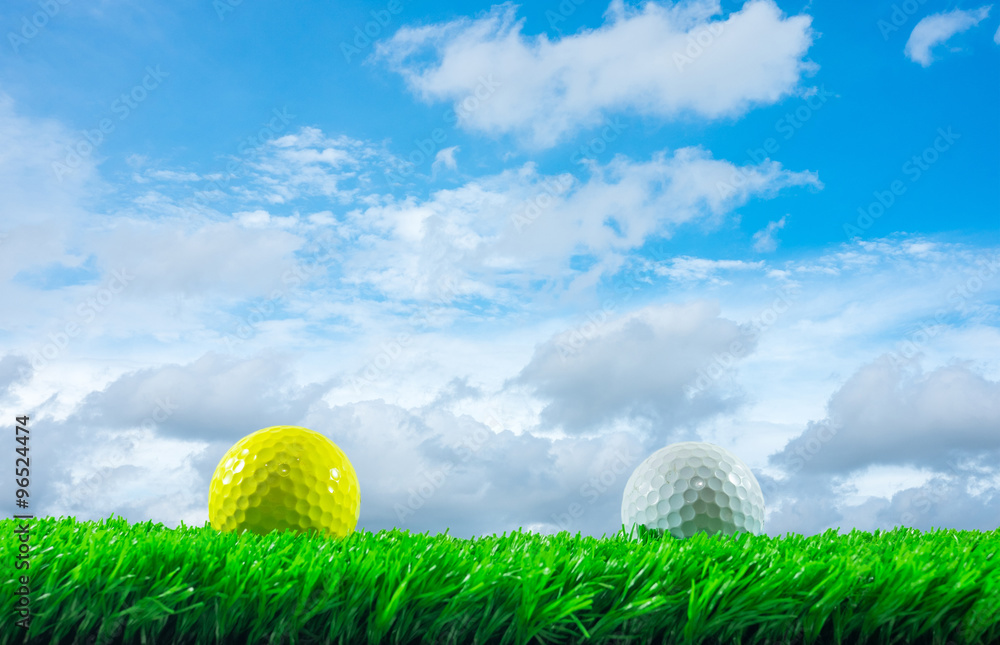 Golf balls on grass