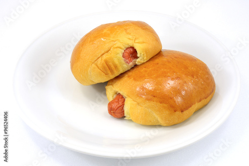 two Bread with Sausage on white plate