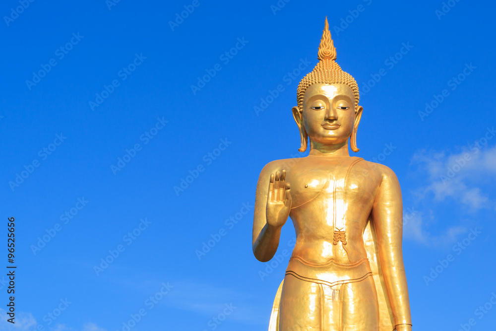 Gold Buddha Statue on blue sky Gold Buddha Statue on blue sky