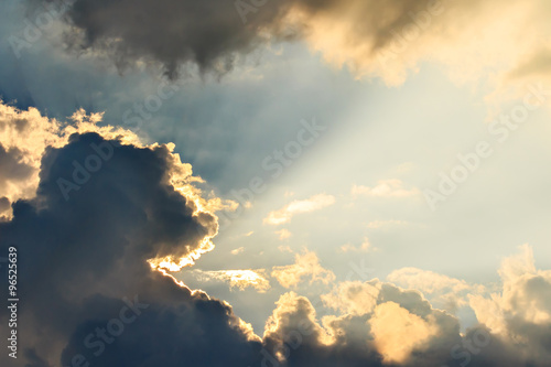 Clouds and sun beams on evening time