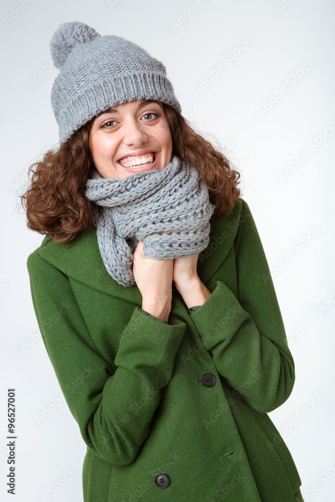 Smiling woman in winter cloth looking at camera Smiling woman in winter cloth looking at camera