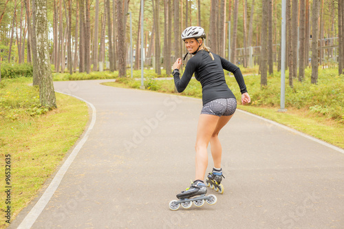 Woman rollerskating and looking back
