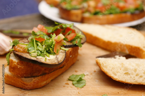 Bruschetta with grilled eggplant and vegetables on ciabatta