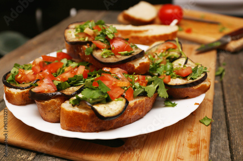 Bruschetta with grilled eggplant and vegetables on ciabatta