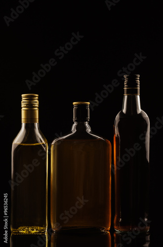 Alcohol drinks on black background without tags