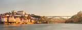 Porto city, Portugal October 17, 2013: panorama of Ribeira, Dom Luis Bridge and Douro river in the sunset