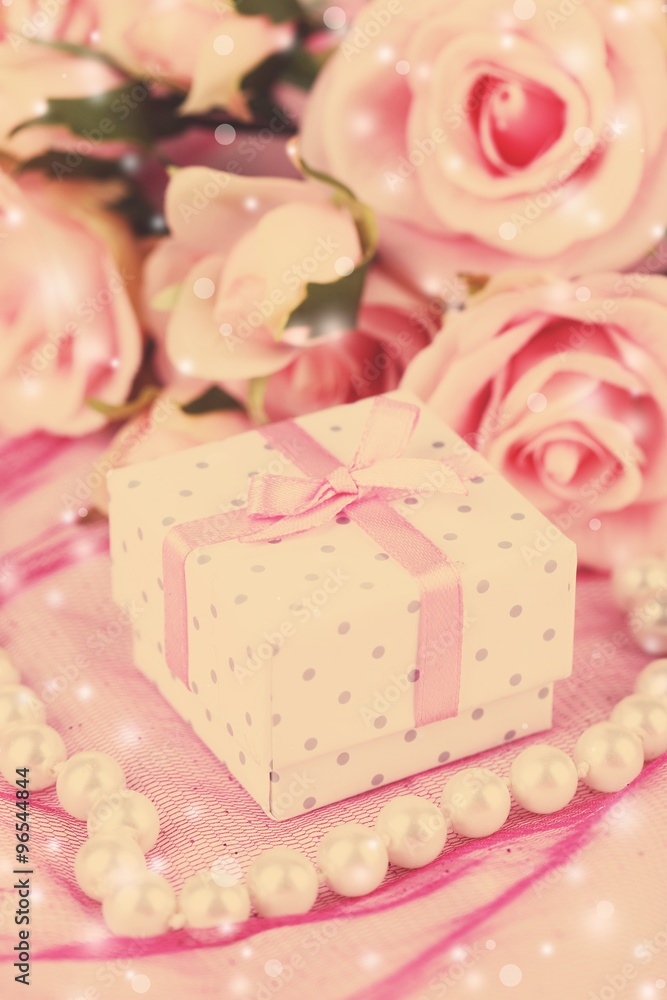 Flowers and gift box on pink background Flowers and gift box on pink background
