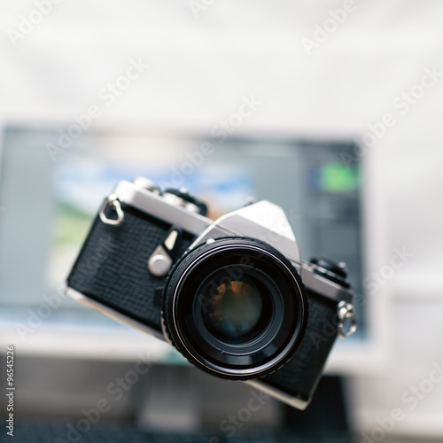 Camera, analog photography over new technology background