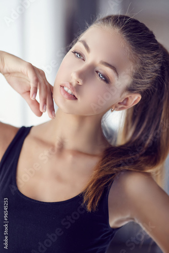 Portrait of young sensual girl in dark t shirt.