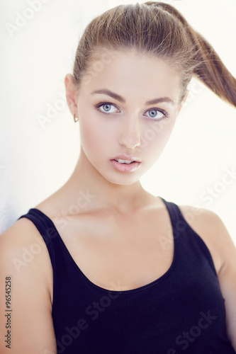 Portrait of young sensual girl in dark t shirt.
