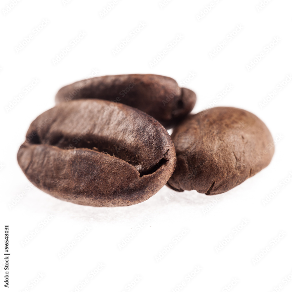 Coffee beans isolated on white closeup Coffee beans isolated on white closeup