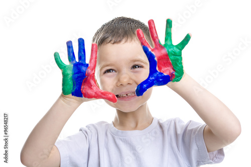 Portrait of little boy with paints on hands isolated on white background