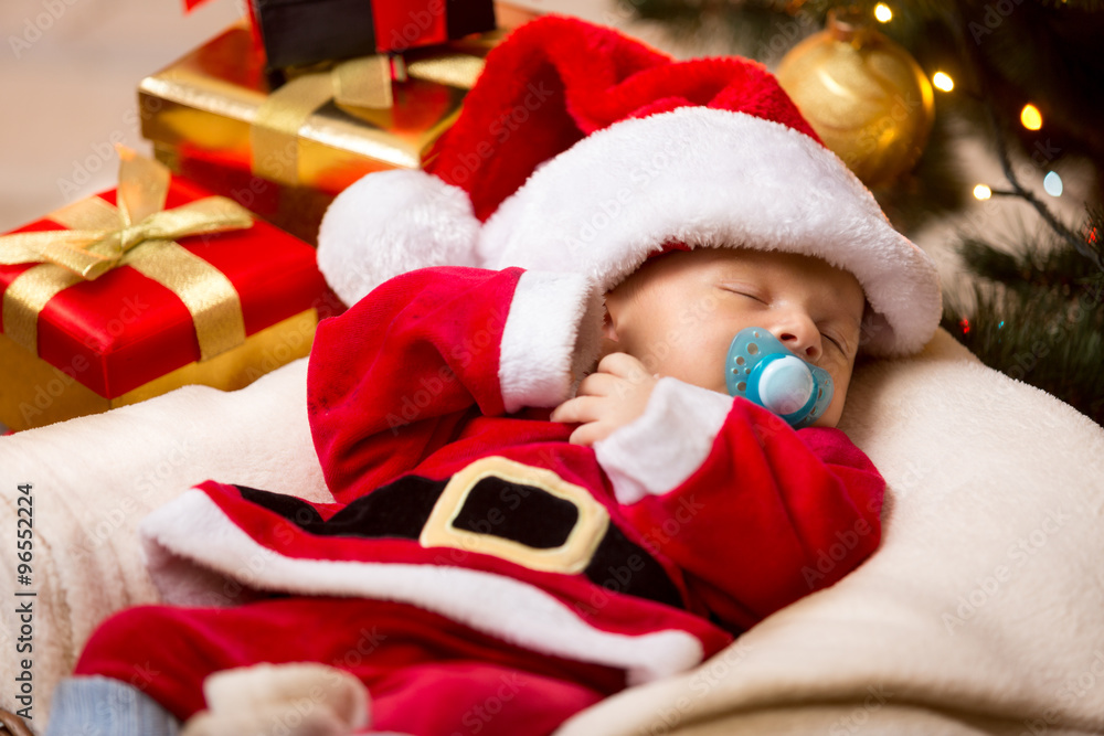 newborn baby sleeping in white and red Santa Claus costume newborn baby sleeping in white and red Santa Claus costume