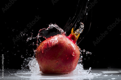 Pomegranate splashing water