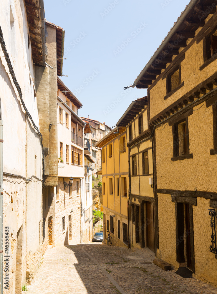narrow street with typical houses in Frias