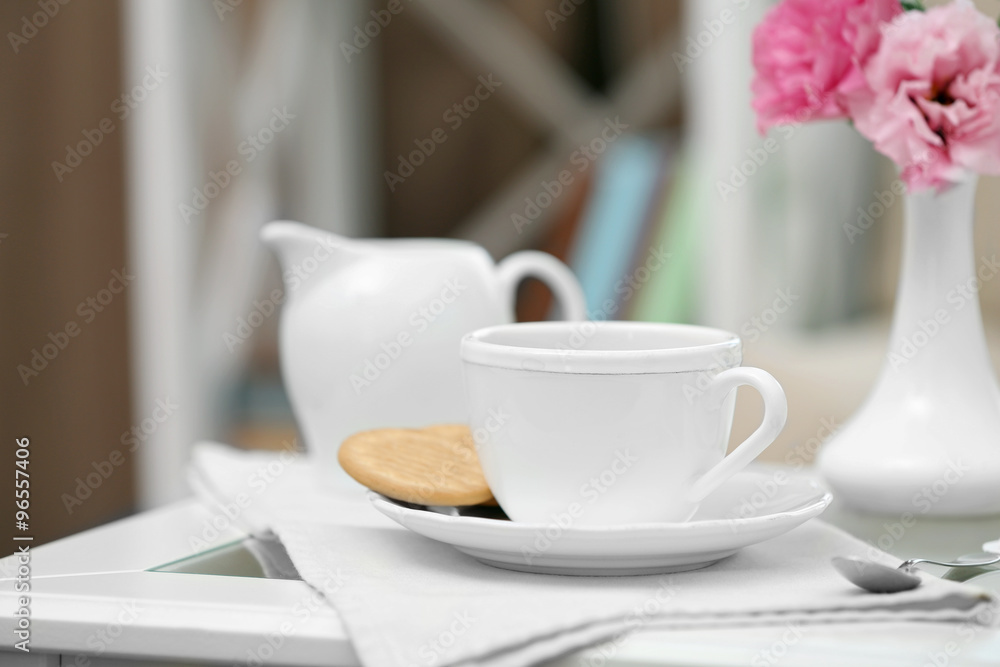 Cup of coffee on table in living room Cup of coffee on table in living room