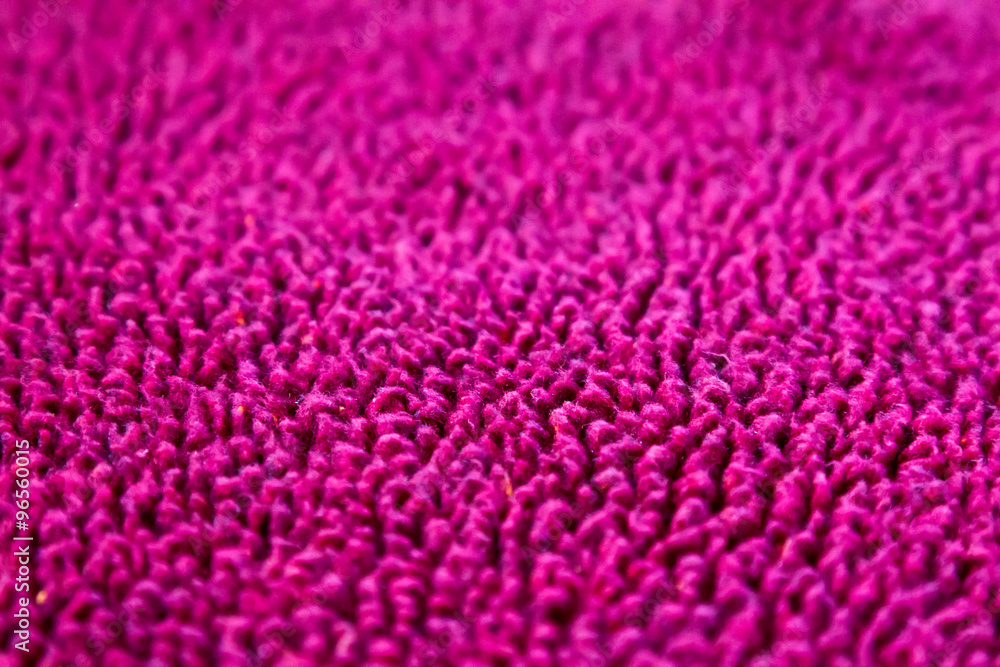 Selective focus on maroon fuzzy fabric Selective focus on maroon fuzzy fabric