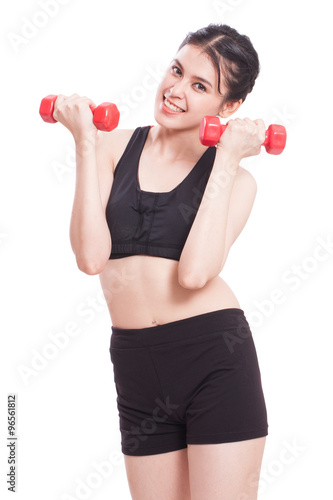 Young Woman doing fitness exercise with a hand weights. healthy lifestyle. 