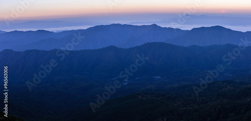 Panoramic view of skyline with mist and mountain at Doi Pha Hom Pok in Chiang Mai, Thailand.