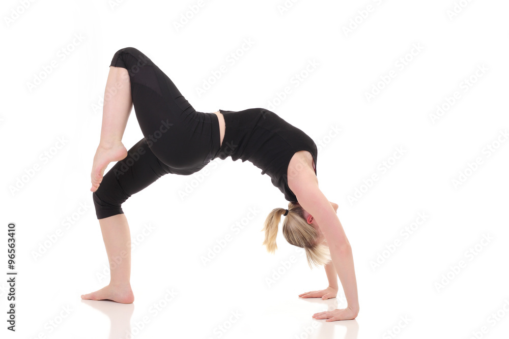  woman doing yoga exercises on yoga mat