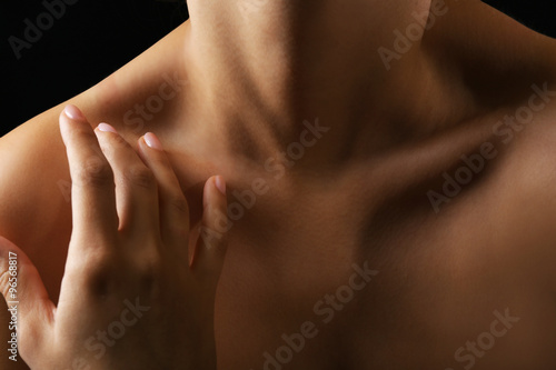 View on woman's neck, collarbone and shoulders, close-up photo