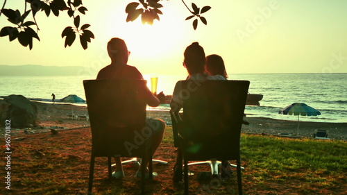 Family dinner at the restaurant on the ocean 